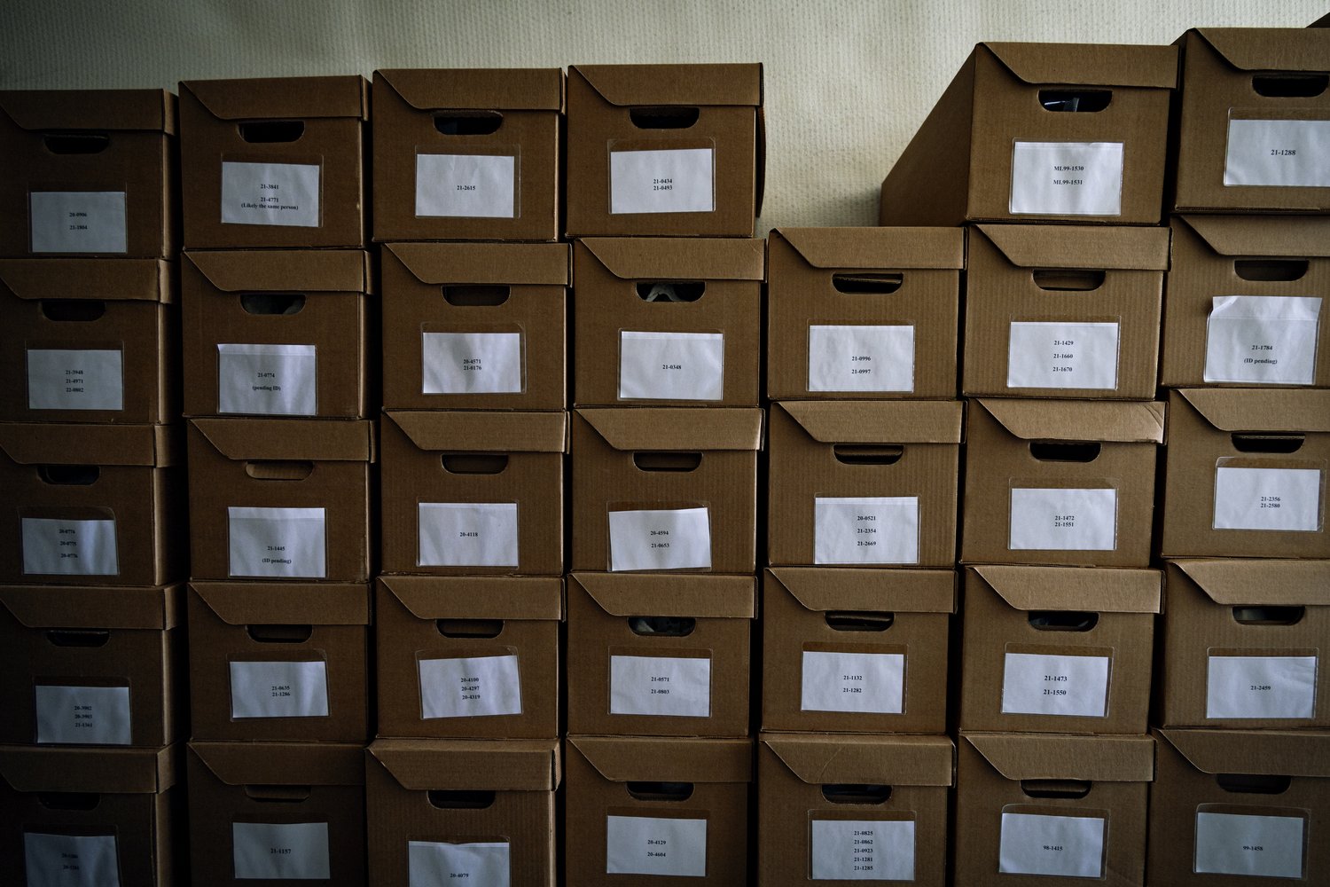 Each box contains bones and the belongings of one or more migrants who perished while attempting to cross the border. © Andrea Godínez