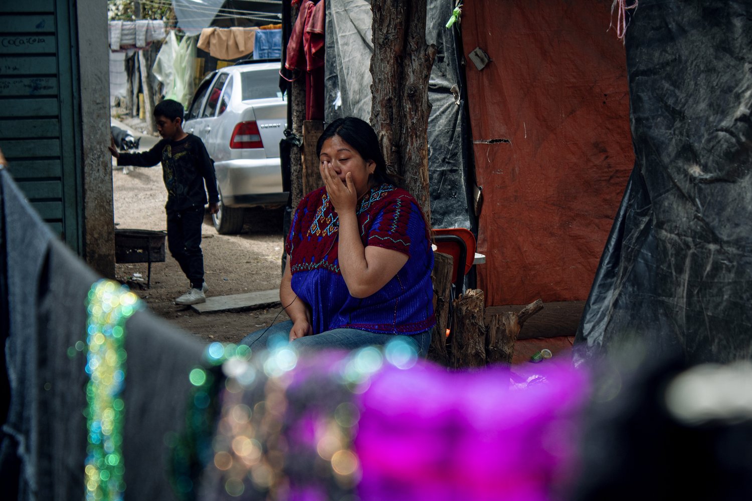 Araceli cries while talking about her brother who disappeared along the border and whose remains were repatriated. © Andrea Godínez