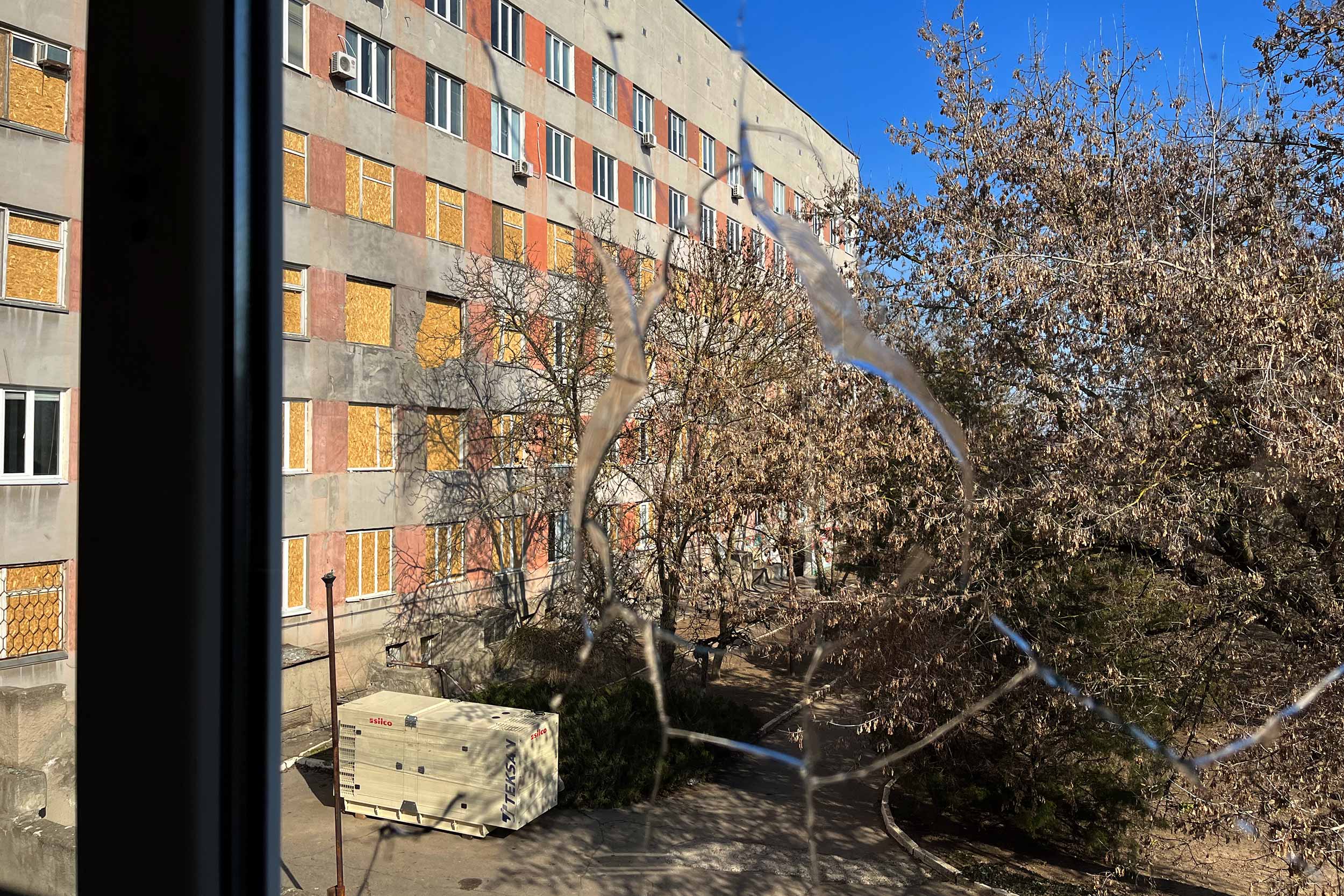 Kherson Children's Hospital was hit by half-a-dozen shells on December 31 and could not continue to function. Most of the windows were either blown out by explosions or damaged and are now blocked off. © Anthony Borden/IWPR