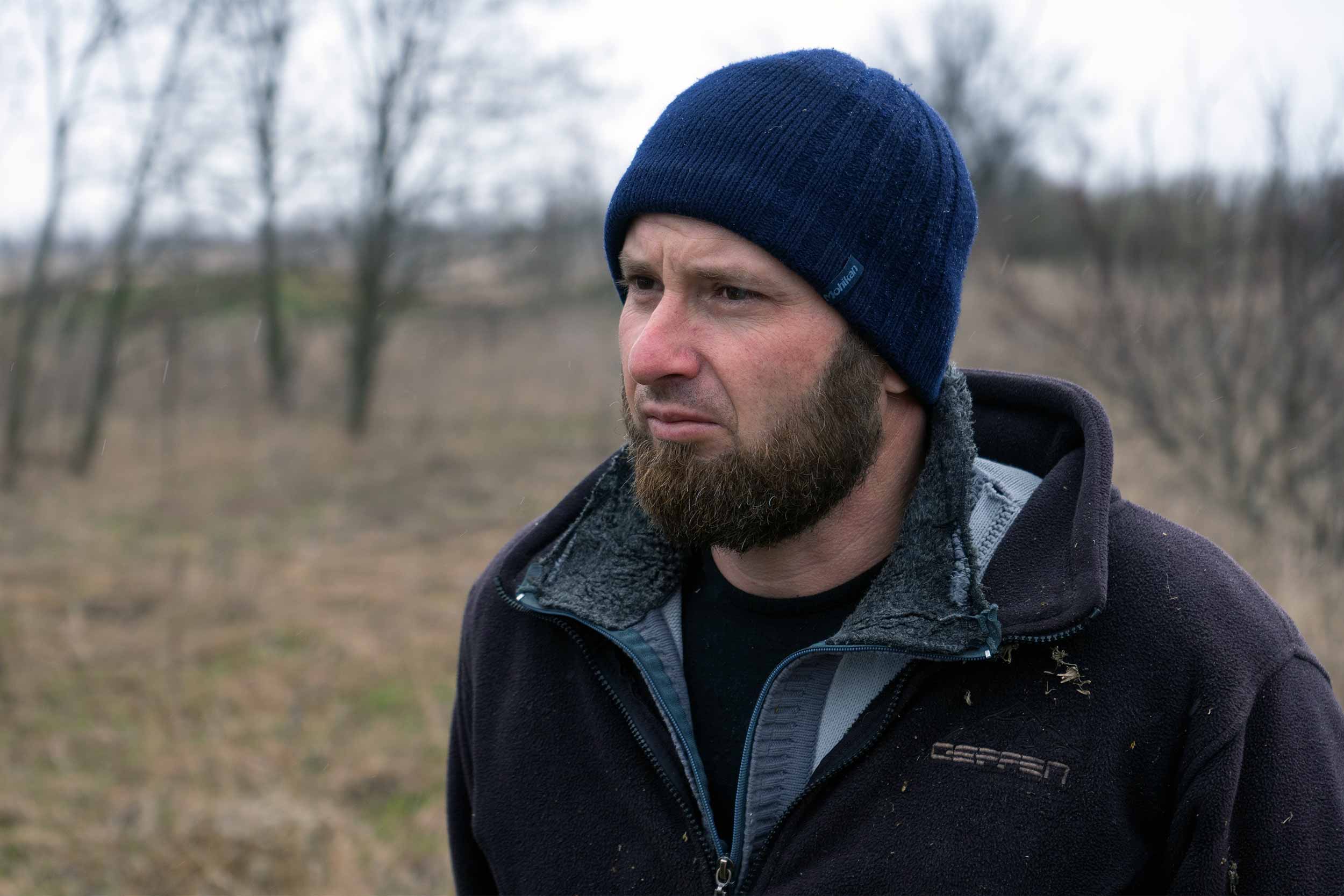 Yevhen Chernyshov, a 36-year-old resident of Hrushivka, found the body of a Russian soldier in a forested area near the village in Kharkiv region. He reported it to the army, which then deployed a J9 team. Information about bodies or informal burial sites is often provided by local residents. © Ihor Tambiiev