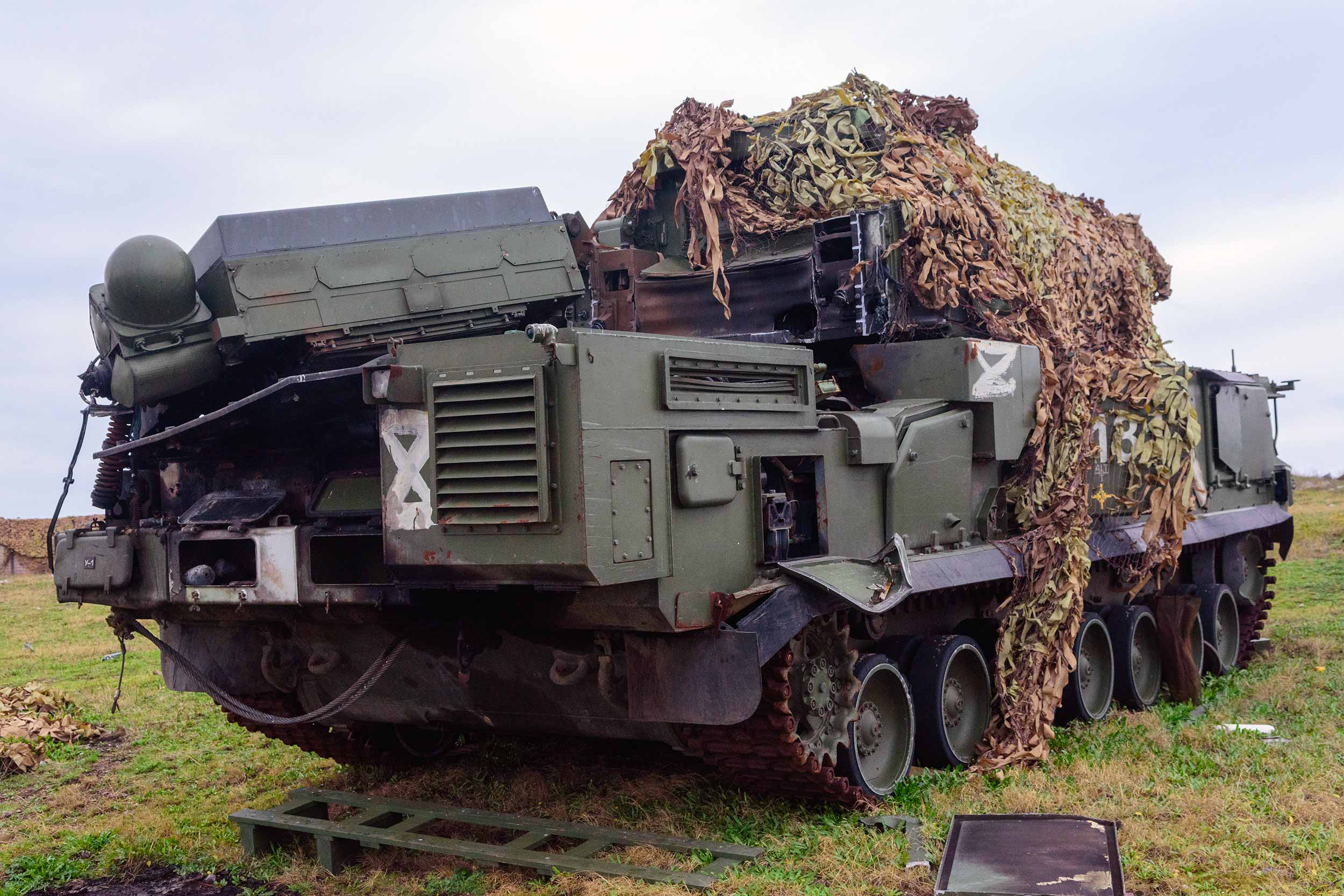 An abandoned Russian TOR missile system. “This is the terror of the Russian army. [It is] destroyed. And this one is almost untouched. We even have stockpiles of missiles for it," Ilya Bohdanov told IWPR. The low- to medium-altitude, short-range surface-to-air missile system was first developed in Soviet times. © Michael Shtekel/IWPR